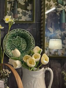 City Farmhouse Warehouse Showroom in Franklin, TN, featuring curated home decor, white tulips, green ceramics, and vintage-inspired accessories.