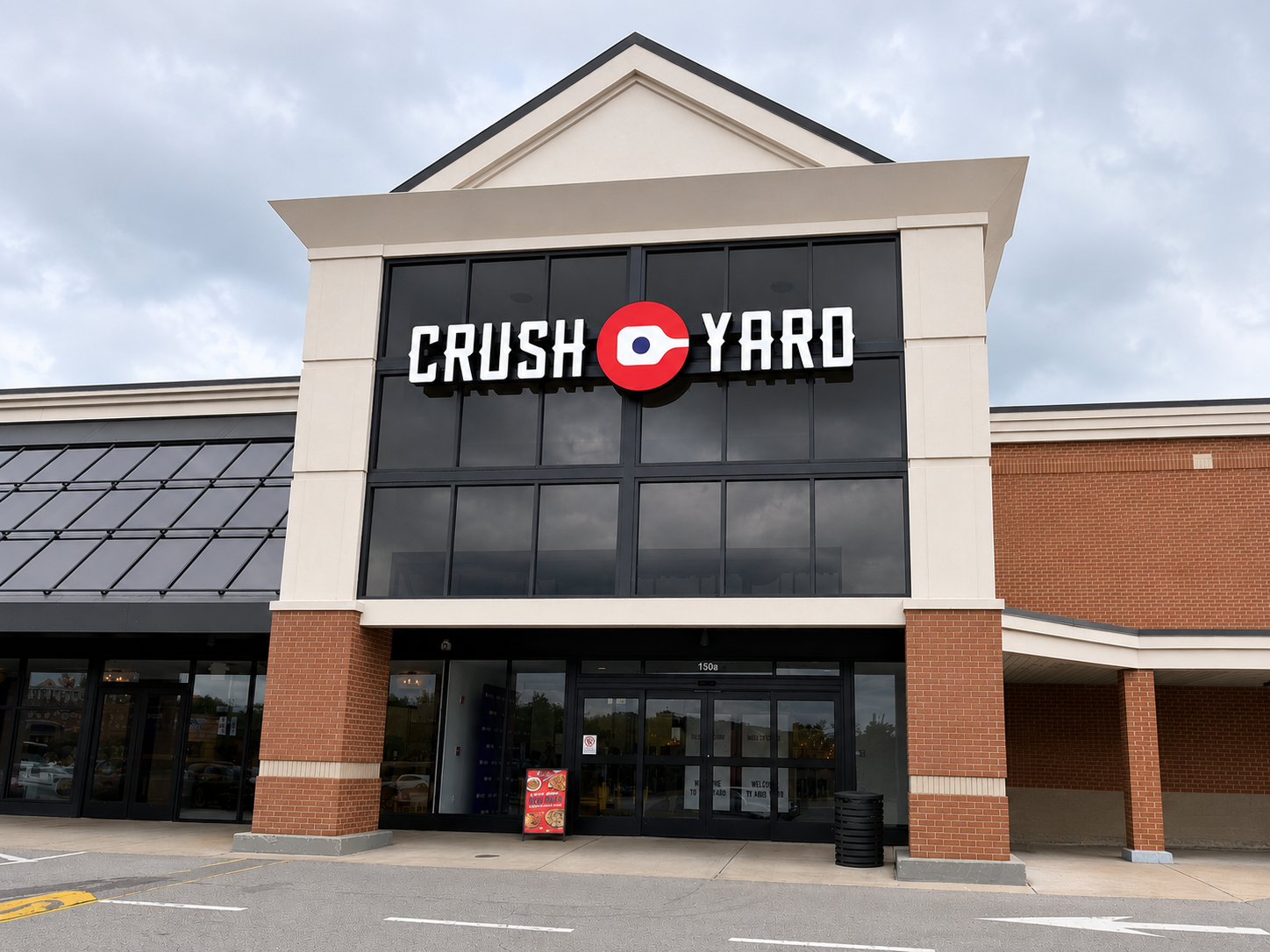 Exterior of Crush Yard in Brentwood, TN with the restaurant and pickleball venue sign above the entrance