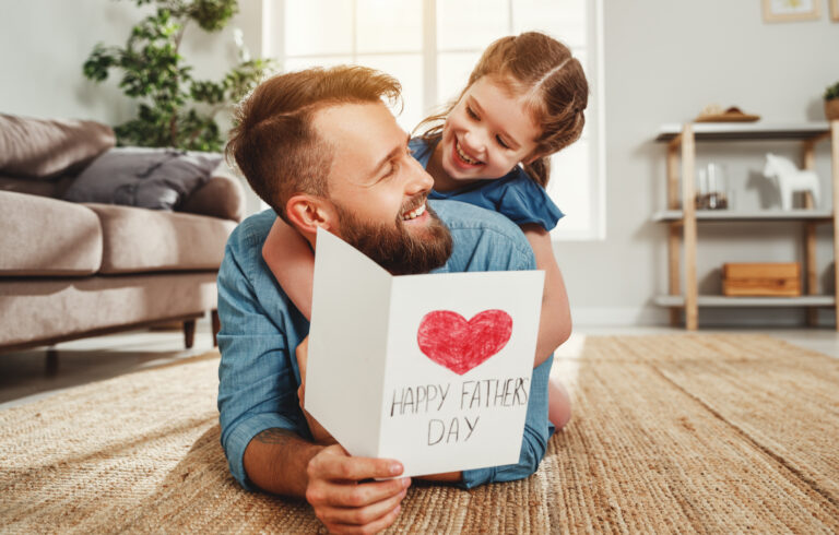 Father receiving a Father’s Day card from his daughter in Franklin and Williamson County TN