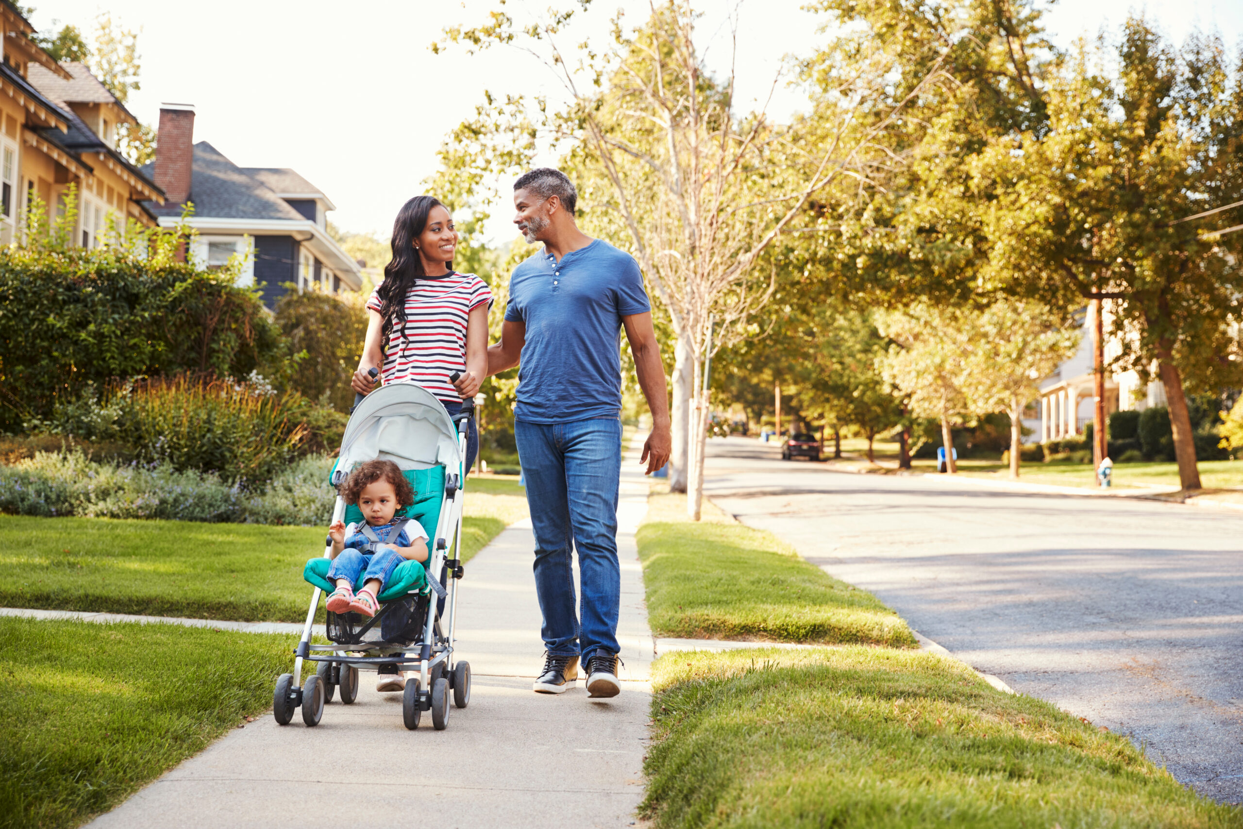 Family walking with stroller in a Franklin TN neighborhood after the city was named one of America’s safest midsize cities