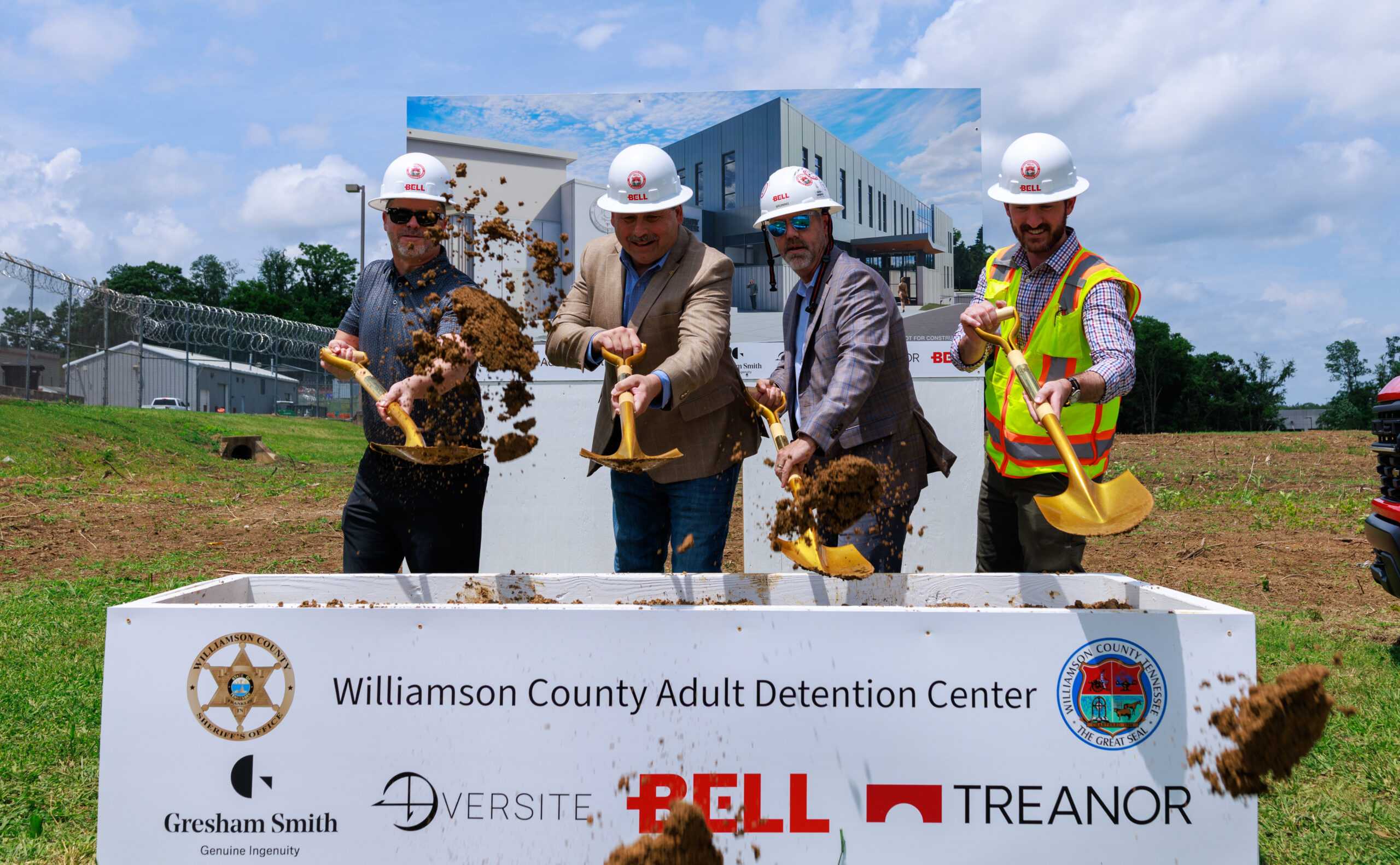Williamson County Adult Detention Center Franklin, TN Groundbreaking, leaders at the event in a group photo holding shovels and dirt.