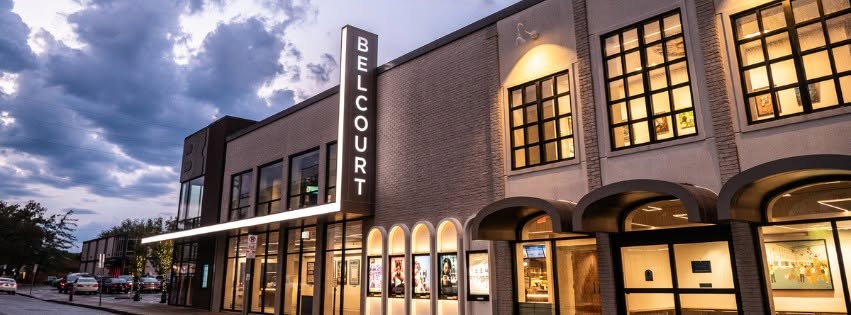 Exterior of the Belcourt Theatre in Nashville’s Hillsboro Village with illuminated signage and entrance doors.