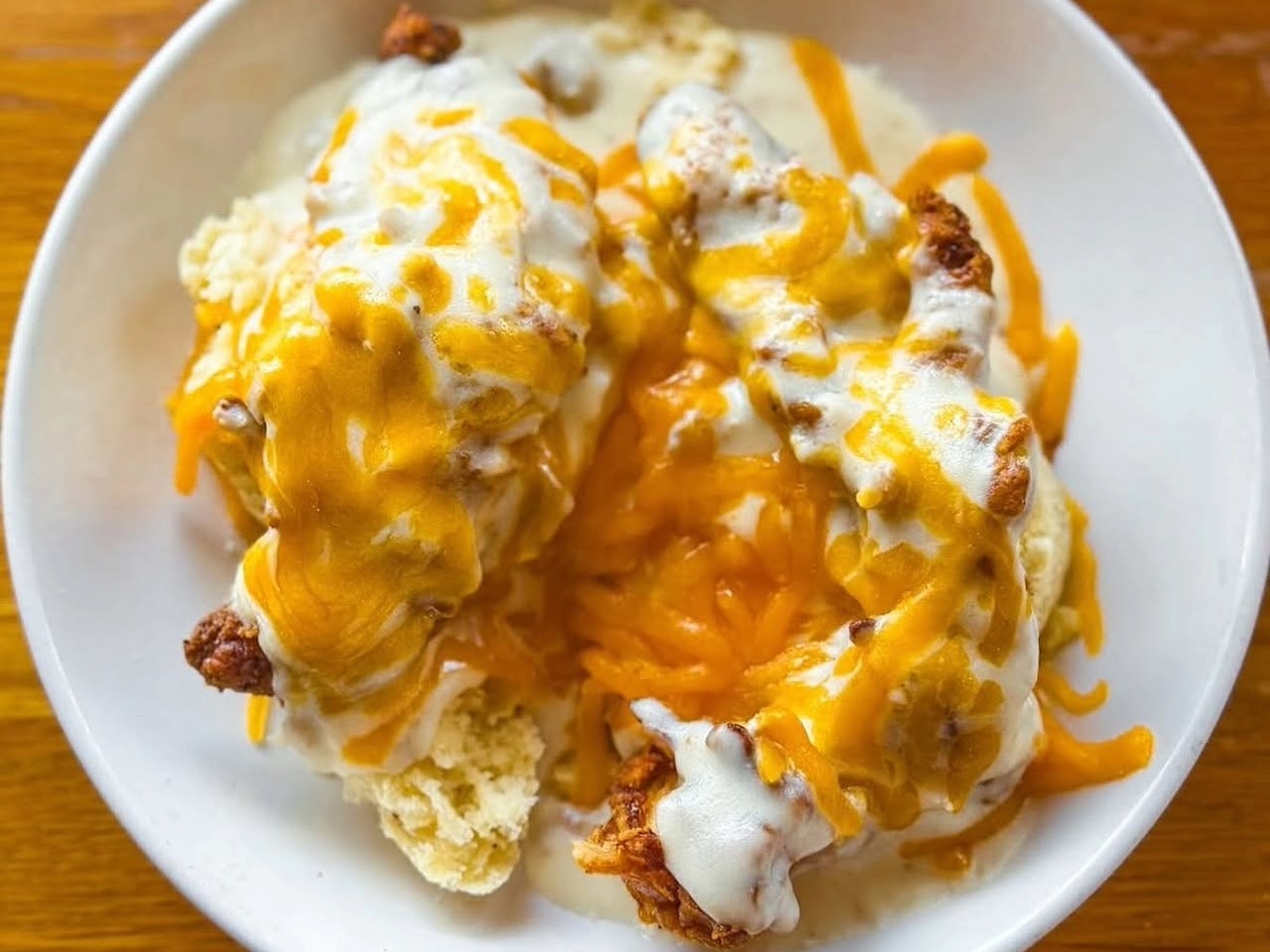 Cathead chicken biscuit with gravy and cheddar cheese at Big Bad Breakfast in Franklin, TN.