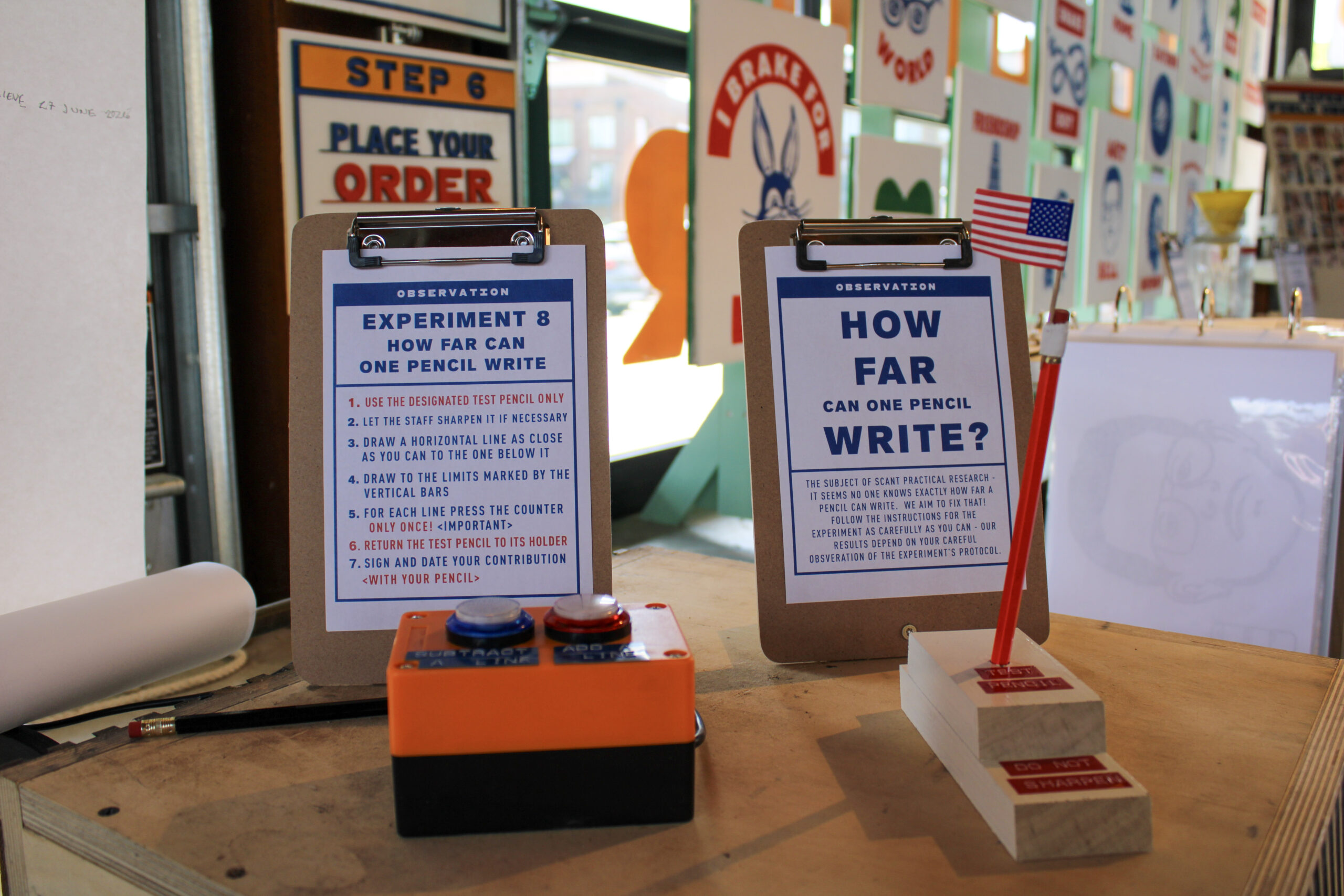 Interactive pencil-writing experiment displayed at Experimart inside The Factory at Franklin in Franklin, Tennessee.