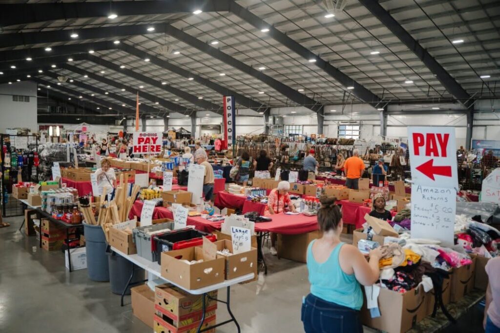 Expo Center event area at The Fairgrounds Nashville with vendor tents, crowds, and event activity.