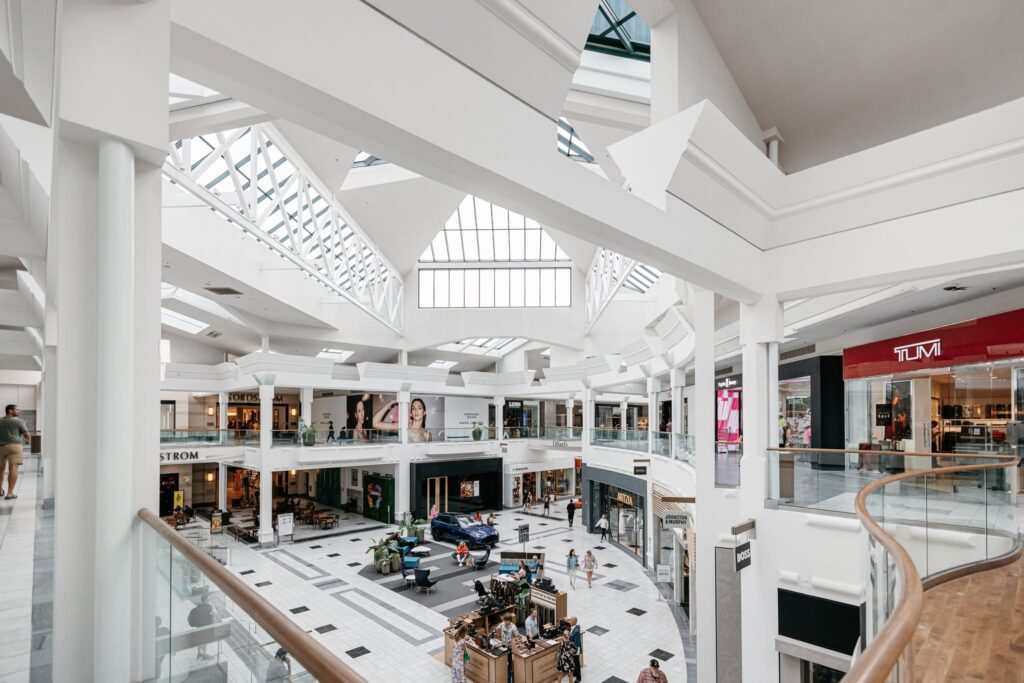 Interior of The Mall at Green Hills in Nashville, Tennessee, featuring two levels of stores, skylights, and an open central shopping area.