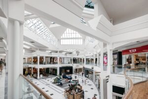 Interior of The Mall at Green Hills in Nashville, Tennessee, featuring two levels of stores, skylights, and an open central shopping area.