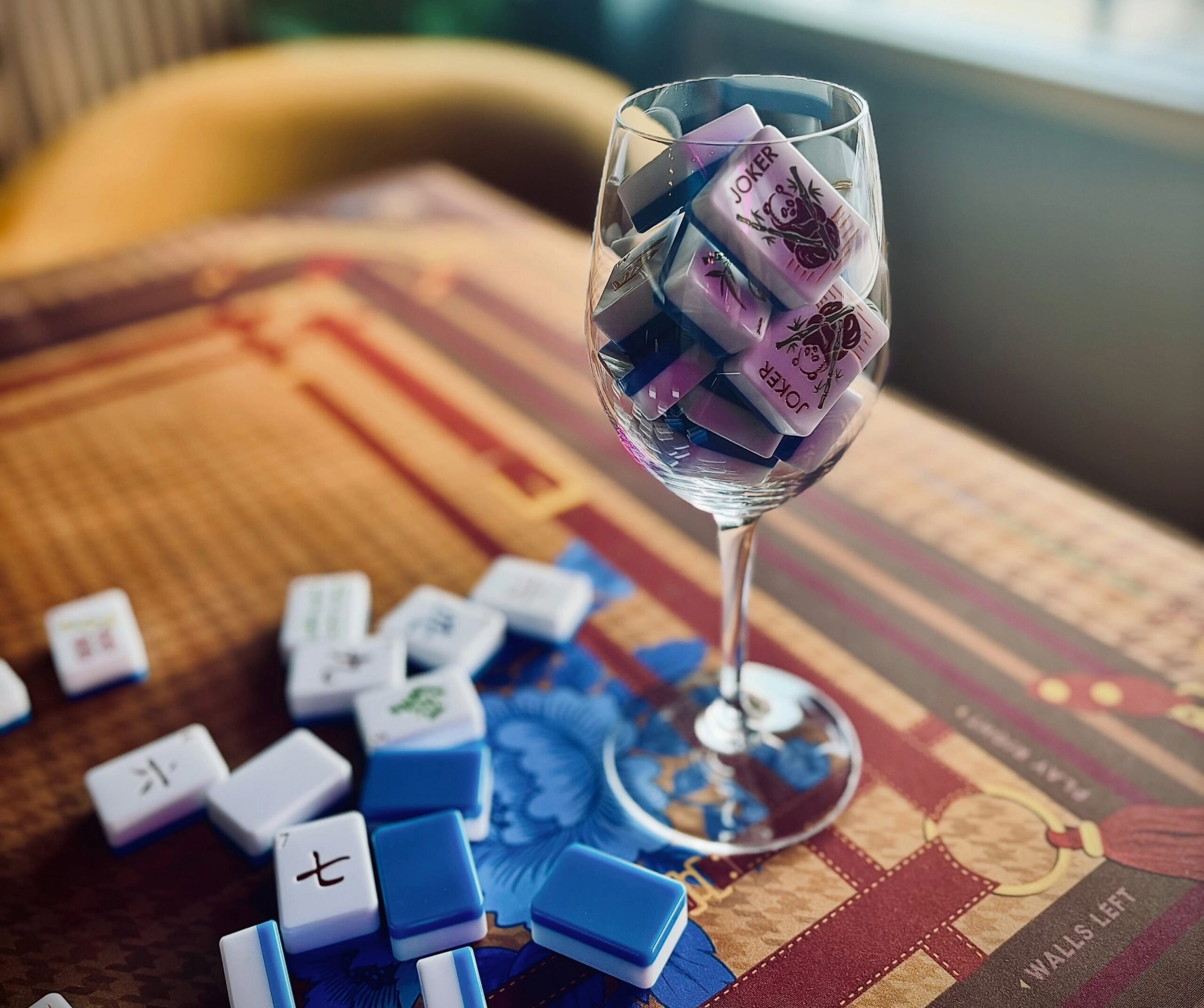 Weekly Mahjong Open Play in Nolensville, Tennessee at The Regal Room, with blue and white Mahjong tiles displayed in a wine glass.