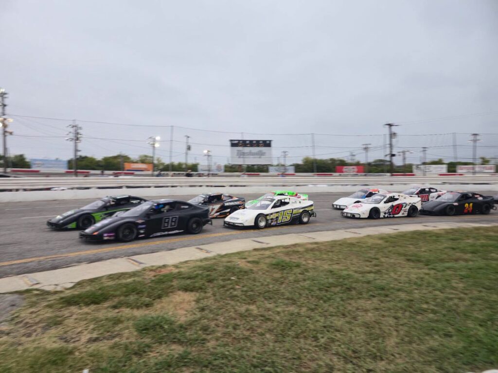 Race cars competing on the track at Nashville Fairgrounds Speedway in Nashville, Tennessee.