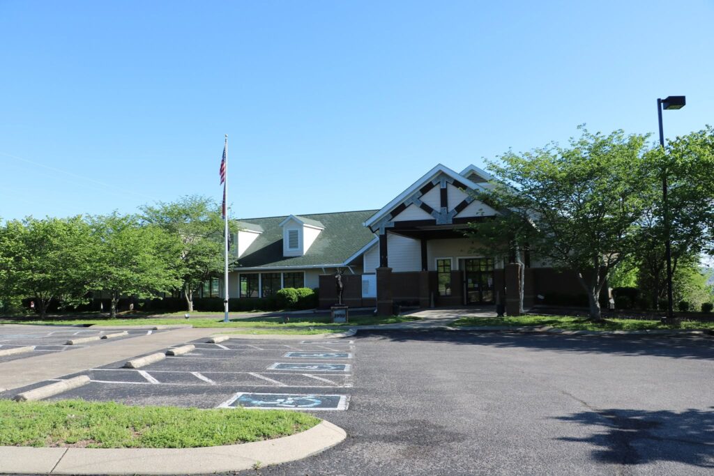 Exterior of Nashville-Franklin Elks Lodge #72 in Tennessee with the lodge building, parking area, and American flag.