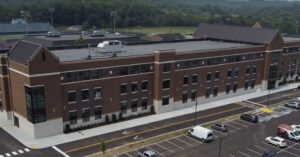 Exterior of Page High School in Franklin, Tennessee, with the school building and parking area visible.