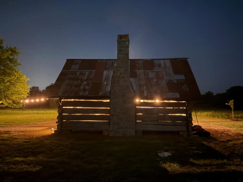 Rustic barn illuminated at night at River Circle Farm in Franklin, Tennessee.