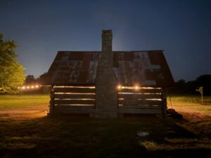 Rustic barn illuminated at night at River Circle Farm in Franklin, Tennessee.