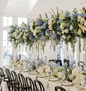 Blue and white floral installation and table arrangements by T Villager Designs for a Nashville wedding reception.
