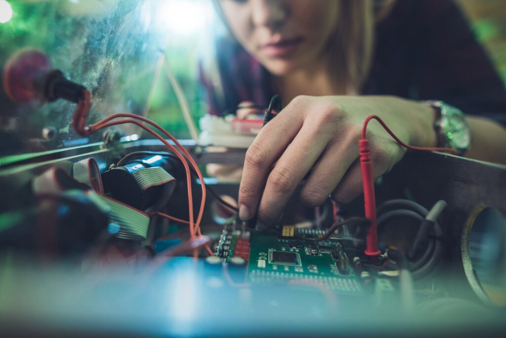 Student working with electronic equipment, representing technical and workforce training at TCAT Murfreesboro’s Smyrna Campus and Nissan Training Center.