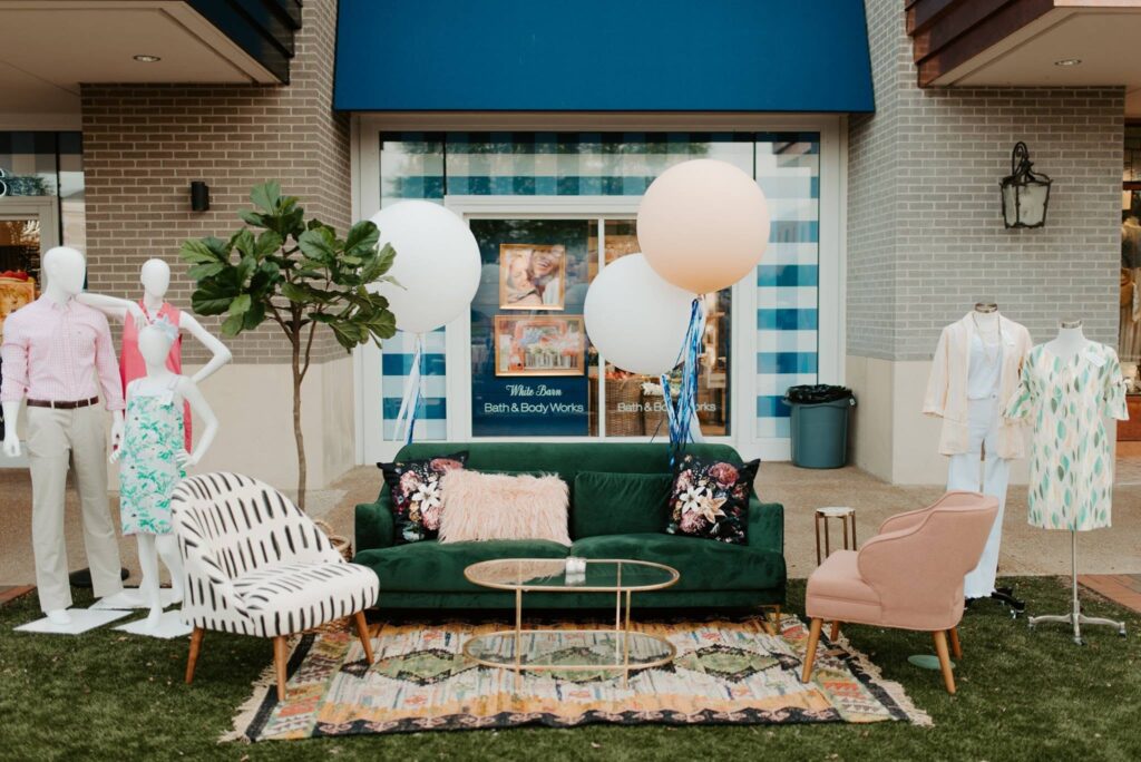 Outdoor seating and storefront displays at The Avenue Murfreesboro shopping center in Murfreesboro, Tennessee.