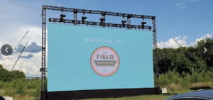 Large outdoor screen at The Field at Franklin drive-in theater in Franklin, Tennessee.