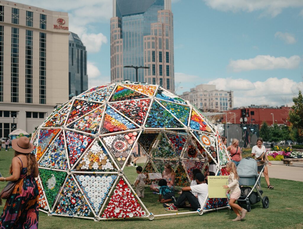Colorful public art installation at Walk of Fame Park in downtown Nashville, Tennessee, with the city skyline in the background.