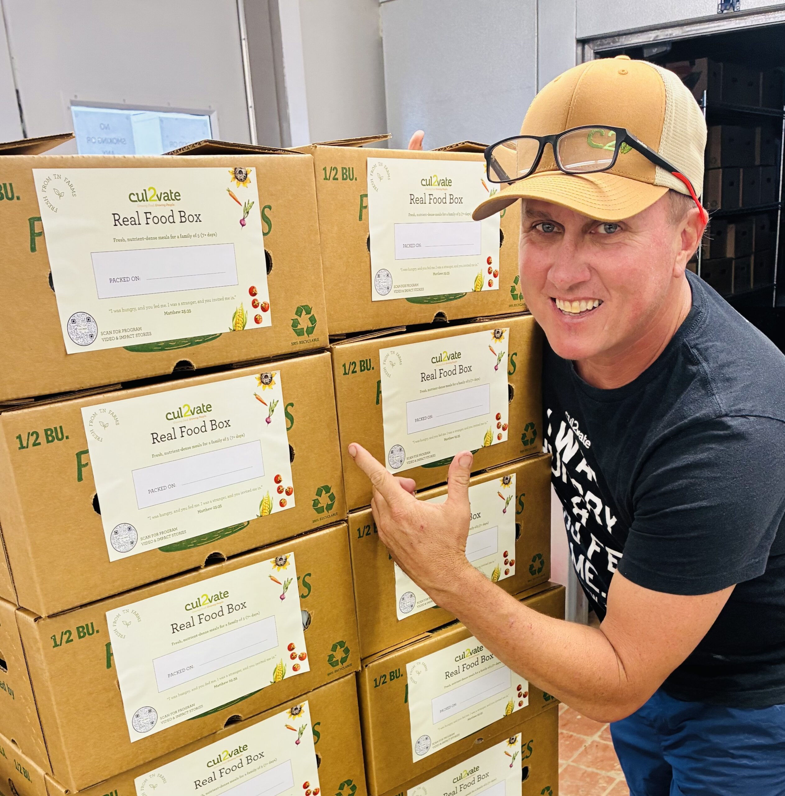 Cul2vate Real Food Box Program Middle Tennessee-Executive Director Joey with Real Food Boxes.
