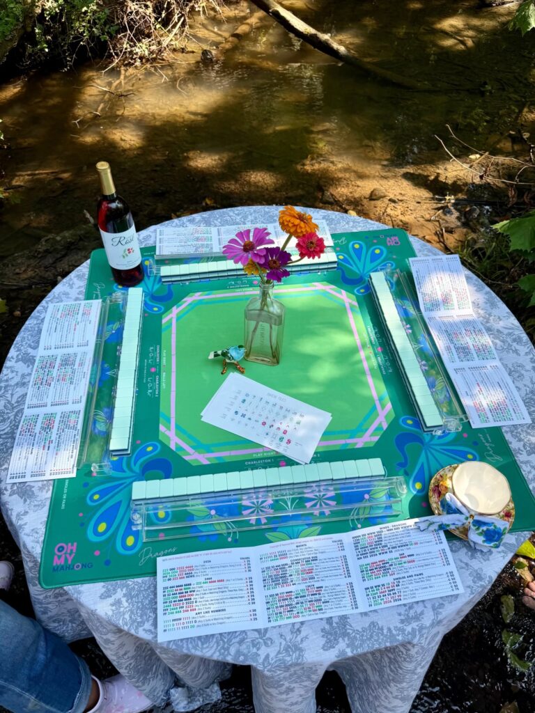 Mahj in the Creek in Leiper's Fork, TN, Fork of the South, BAMFoods Catering, and Crown Winery are coming together for Mahj in the Creek—a special, limited-ticket experience set right in the waters of beautiful Leiper’s Creek.