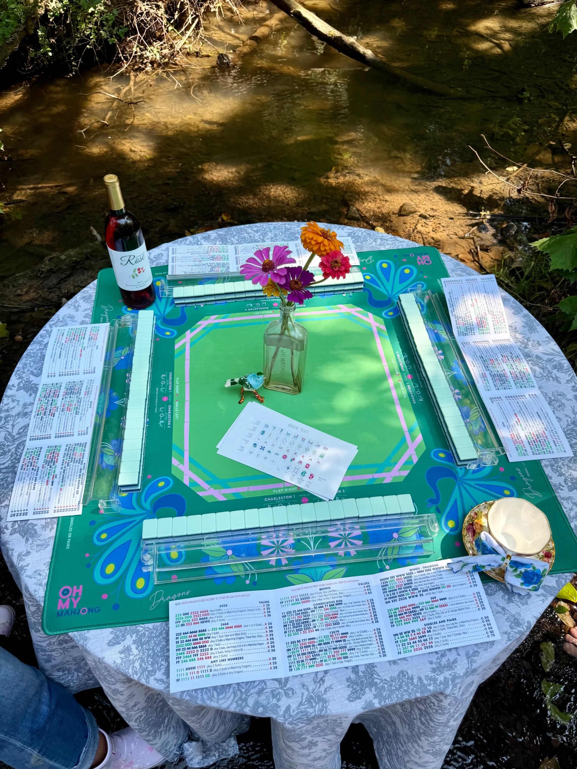 Mahj in the Creek in Leiper's Fork, TN, Fork of the South, BAMFoods Catering, and Crown Winery are coming together for Mahj in the Creek—a special, limited-ticket experience set right in the waters of beautiful Leiper’s Creek.