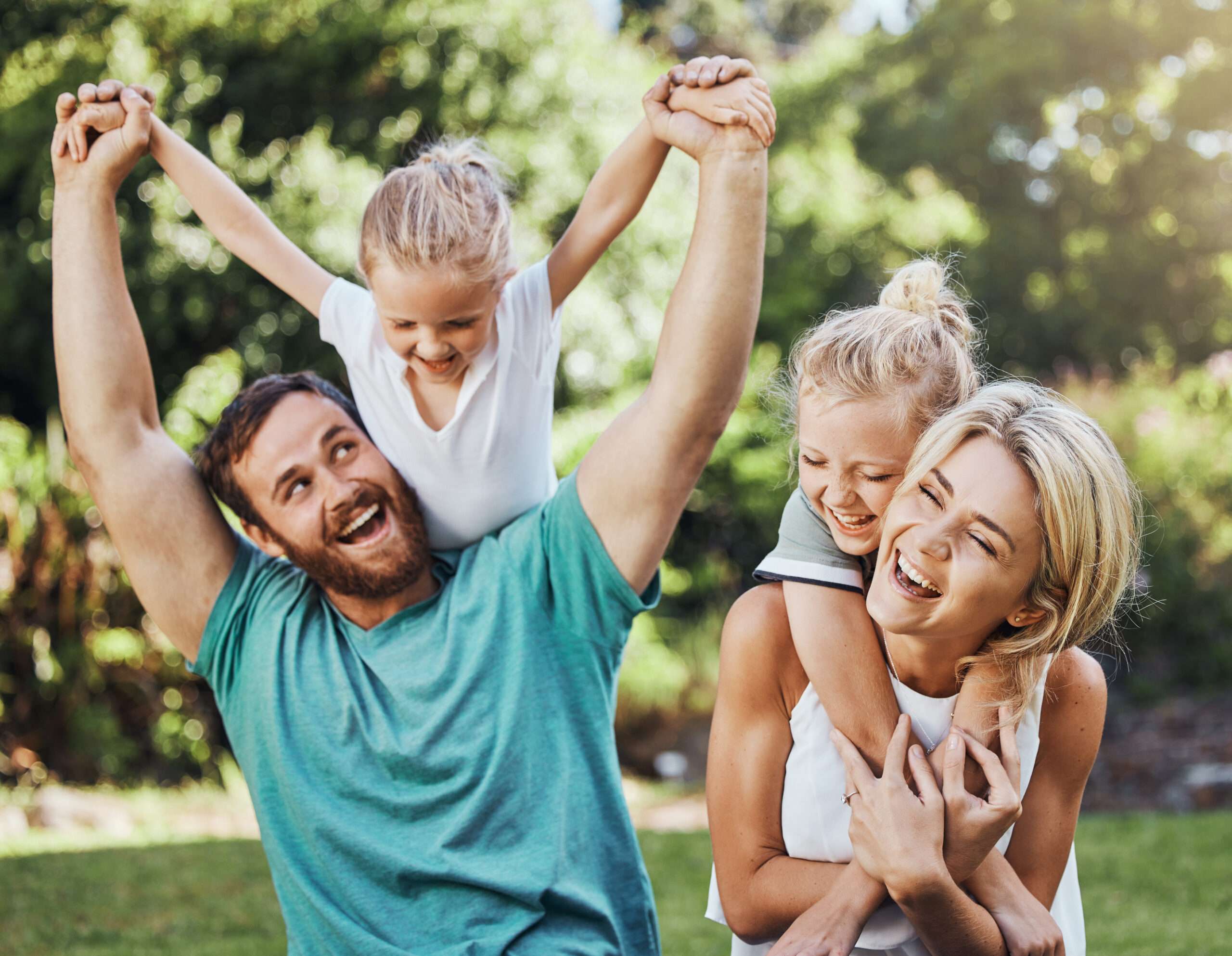 Family enjoying quality time together outdoors in a park in Williamson County, Tennessee, before the start of the new school year.