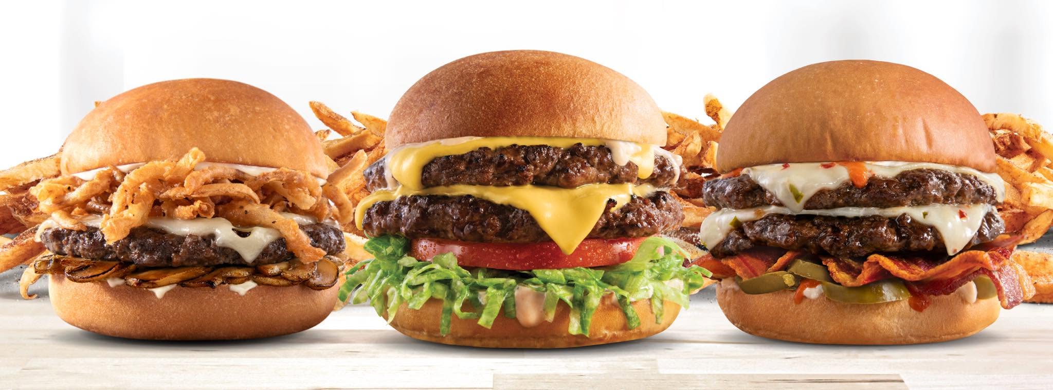 Three MOOYAH burgers with fries from MOOYAH Burgers, Fries & Shakes in Franklin, Tennessee.