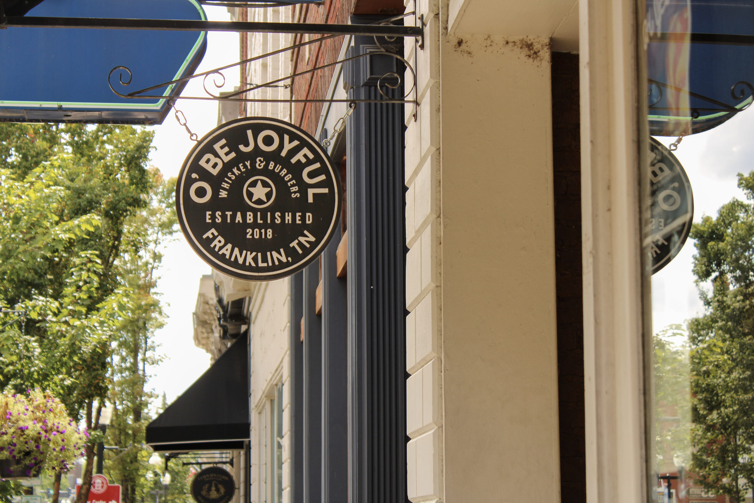 O’ Be Joyful whiskey and burgers sign in downtown Franklin, Tennessee