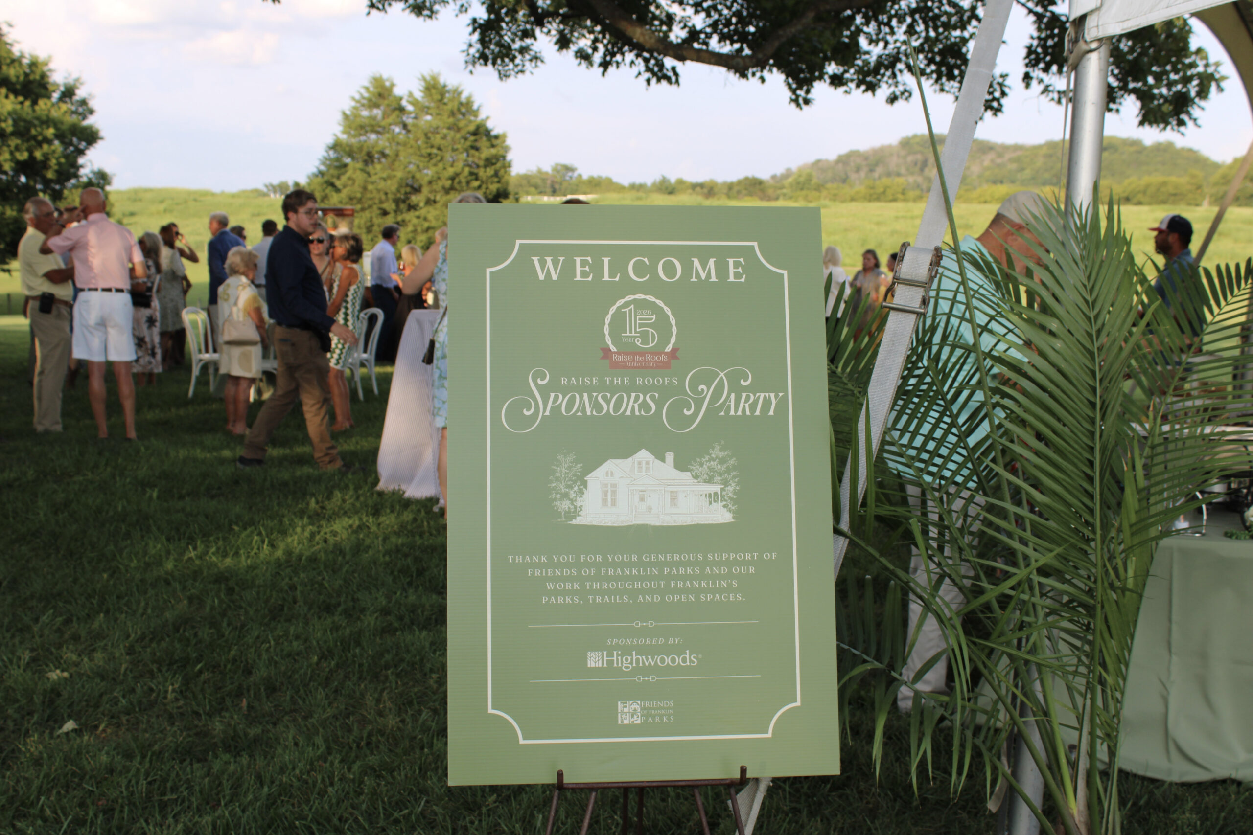 Raise the Roofs Sponsors Party welcome sign on the lawn at Hayes House in Franklin, Tennessee.