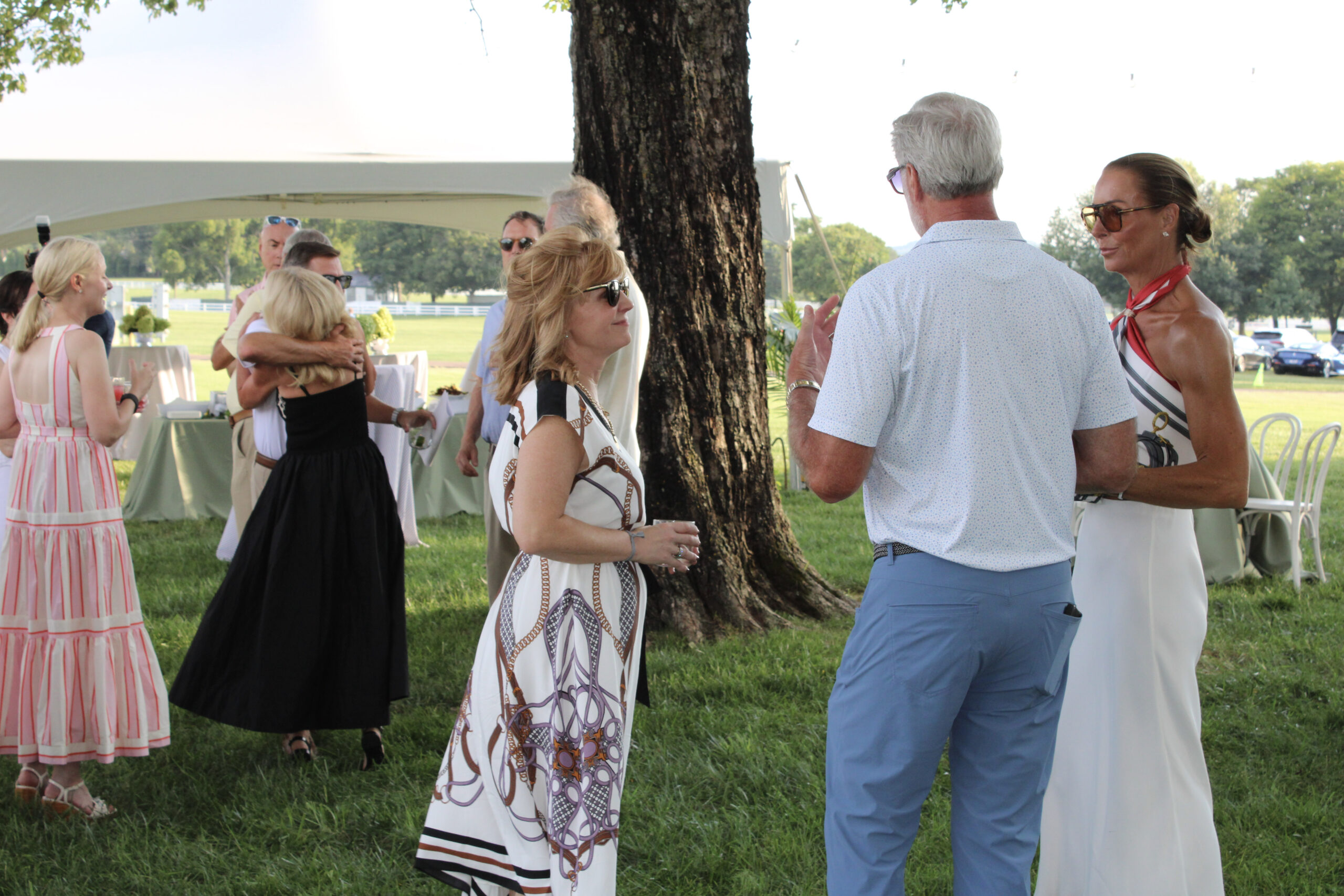 Torrey Barnhill, Executive Director of Friends of Franklin Parks, talks with guests at the 2026 Raise the Roofs Sponsors Party in Franklin, Tennessee.