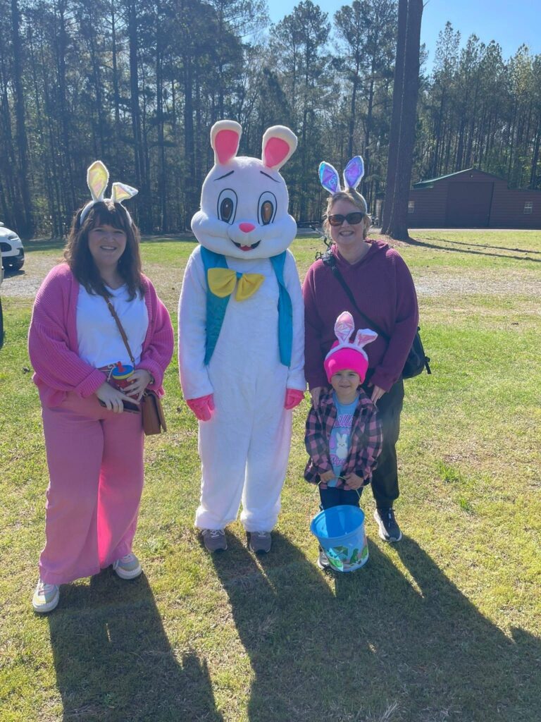 Family posing with the Easter Bunny at the Fairview Annual Easter Egg Hunt