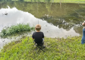 Child fishing from the bank during the Fairview Fishing Rodeo in Fairview, Tennessee