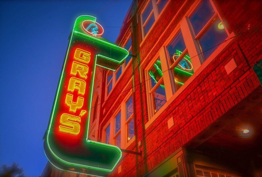 Gray’s on Main neon sign in downtown Franklin, Tennessee, home of the upcoming Buffalo Room overlooking the live music stage.
