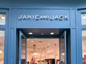 A Janie and Jack store front at a shopping mall. Janie and Jack is an American children's fashion brand owned by Gap Inc.