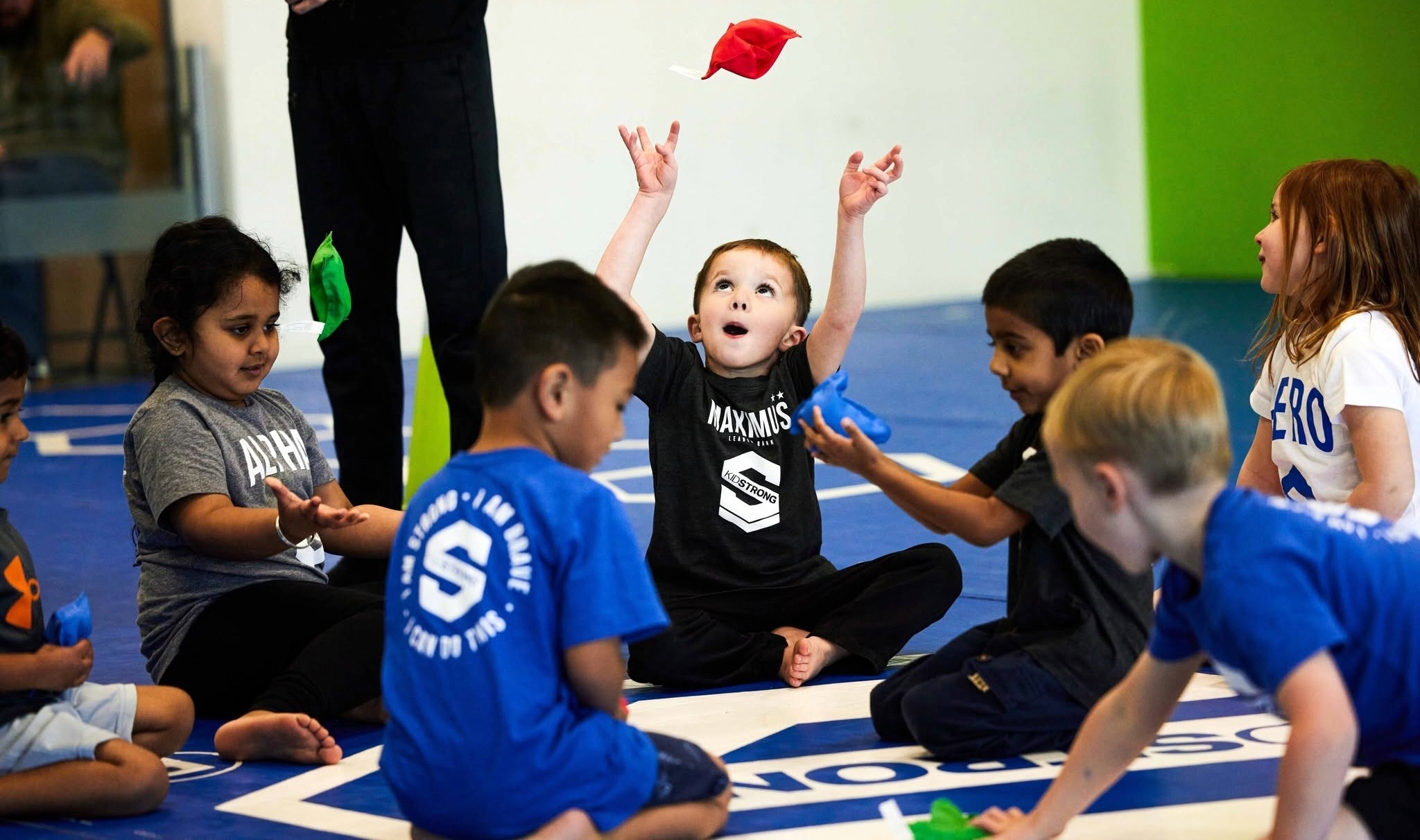 Children participate in a coach-led KidStrong development class with movement, coordination, and group activities in Franklin, Tennessee.