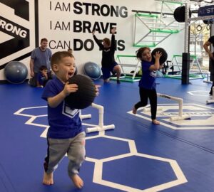 Kids participating in a KidStrong class in Franklin, Tennessee, with movement and strength-building activities.