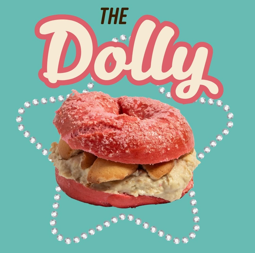 The Dolly Bagel at Ugly Bagel in Franklin, Tennessee, featuring a pink sparkle bagel with banana pudding cream cheese and vanilla wafers.