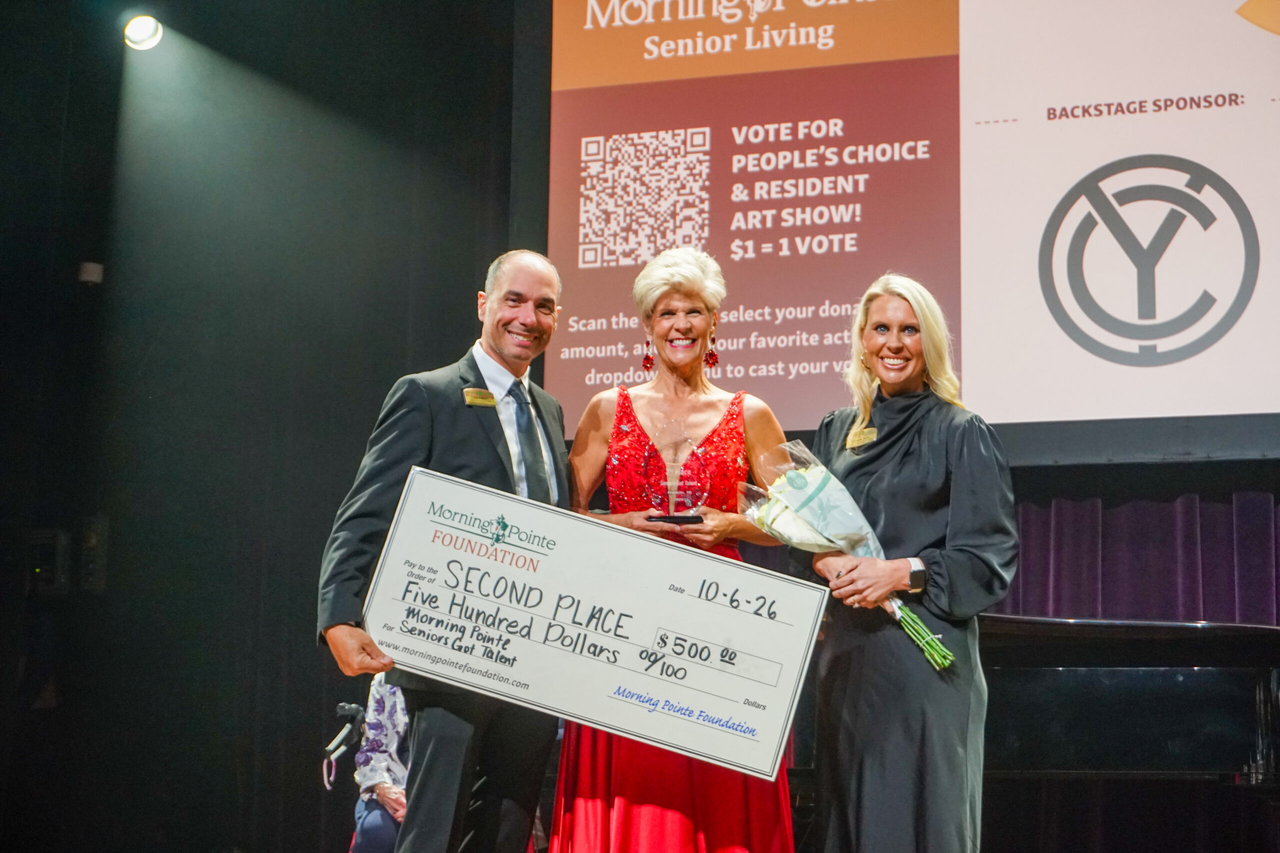 From left: MorningPointe’s Senior Vice President of Services and Assets Rob Pollard, second place winner Sandy Elliott, and Miranda Perez Executive Director of the Morning Pointe Foundation.