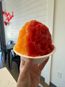 Large red and orange shaved ice served at Cream and Sugar in Franklin, Tennessee.
