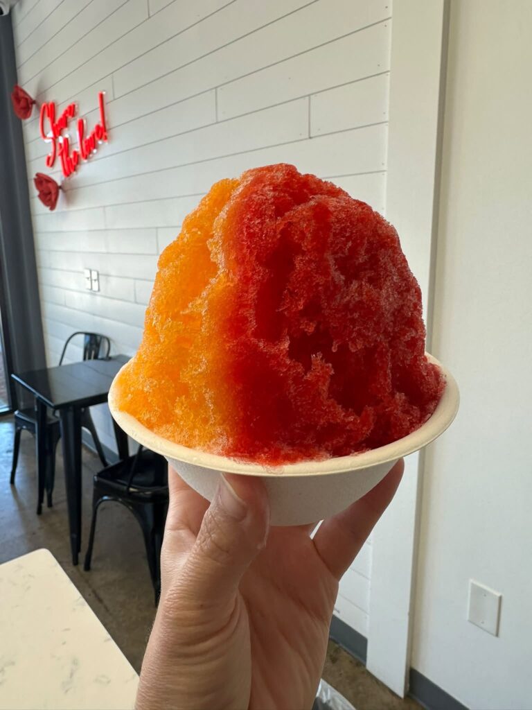 Large red and orange shaved ice served at Cream and Sugar in Franklin, Tennessee.