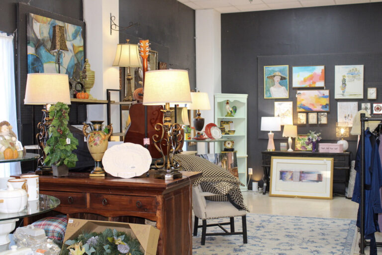 Decorative lamps, framed artwork, furniture, and home accessories displayed in the GraceWorks Thrift boutique in Franklin, TN.