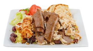 Mediterranean platter with grilled meats, shrimp, rice, salad, olives, and pita bread from Gyros King in Franklin, Tennessee.