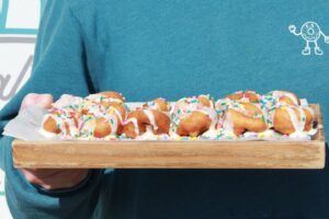 Fresh mini donuts topped with icing and colorful sprinkles from Itty Bitty Donuts in Nolensville, Tennessee.