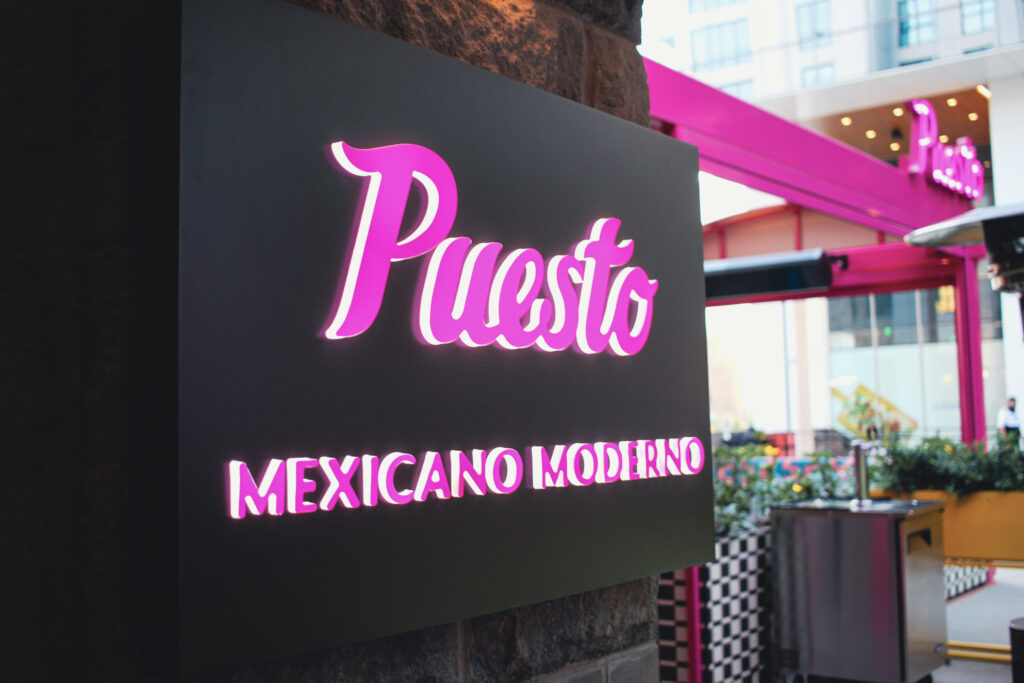Exterior sign at Puesto Mexican restaurant in Nashville Yards, Nashville, TN.
