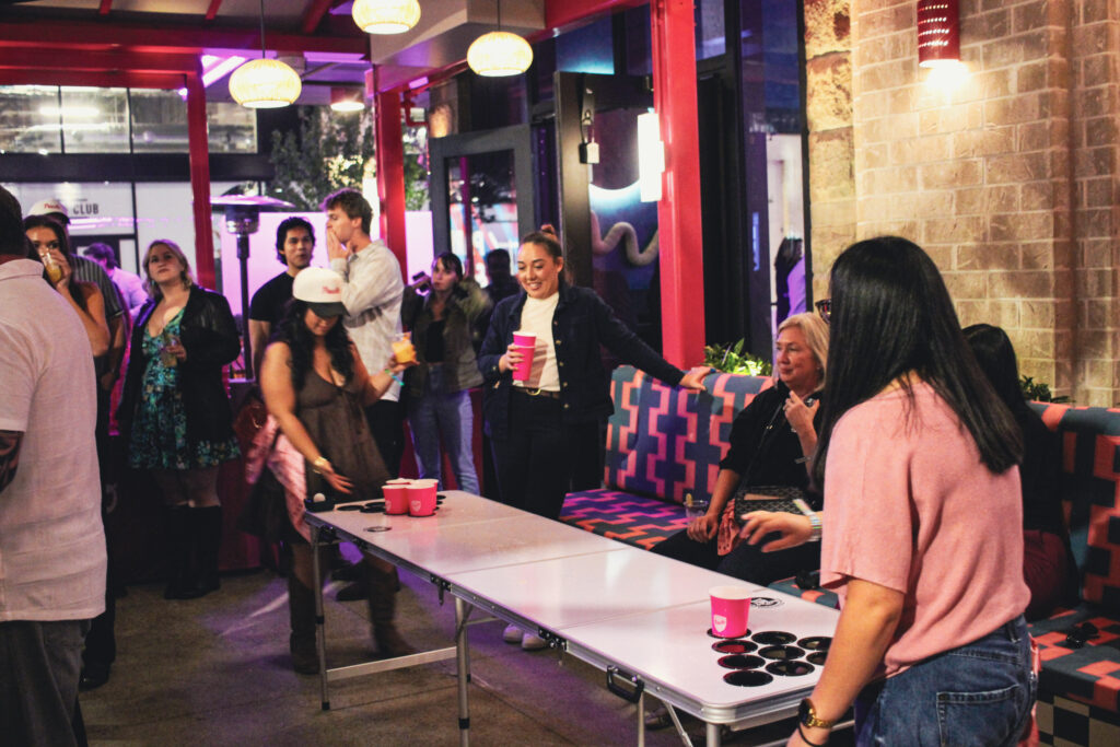 Guests playing table pong on the outdoor patio at Puesto in Nashville Yards, Nashville, TN.