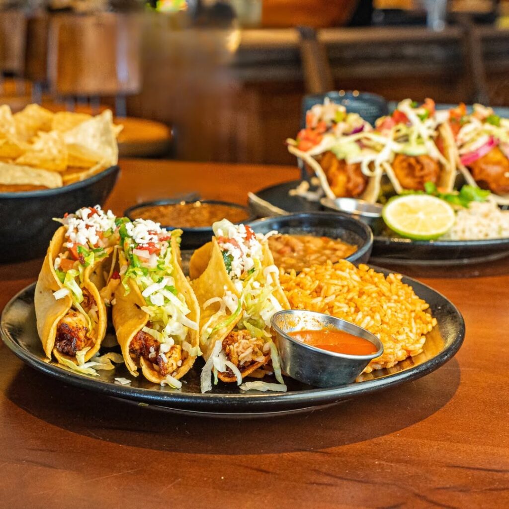 Tacos served with Mexican rice, beans, chips, and salsa at Uncle Julio’s in Brentwood, Tennessee.