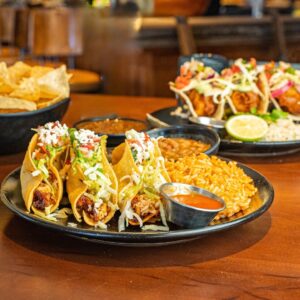 Tacos served with Mexican rice, beans, chips, and salsa at Uncle Julio’s in Brentwood, Tennessee.