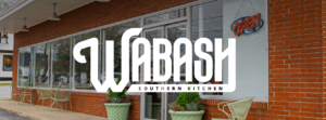 Southern dishes at Wabash Southern Kitchen in Nolensville, Tennessee, including salad, wraps, chips, queso, and other menu items.
